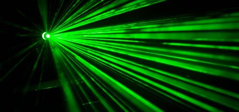 Several beams of light coming from a green laser.
