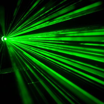Several beams of light coming from a green laser.