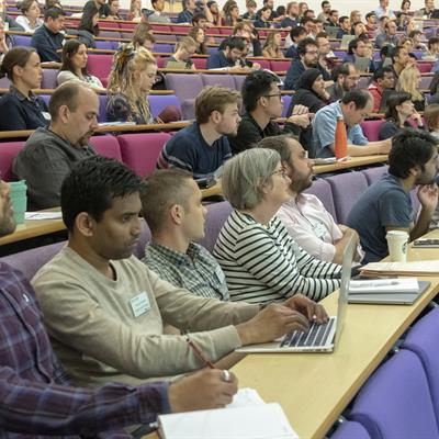 Audience sitting in a lecture theatre at the CCP-EM Spring Symposium 2019