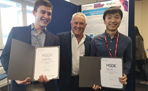 ​​​​​​​​​Daniele Visco and Griffin Gui being presented their prizes for best MRes posters by Prof. Julian Eastoe